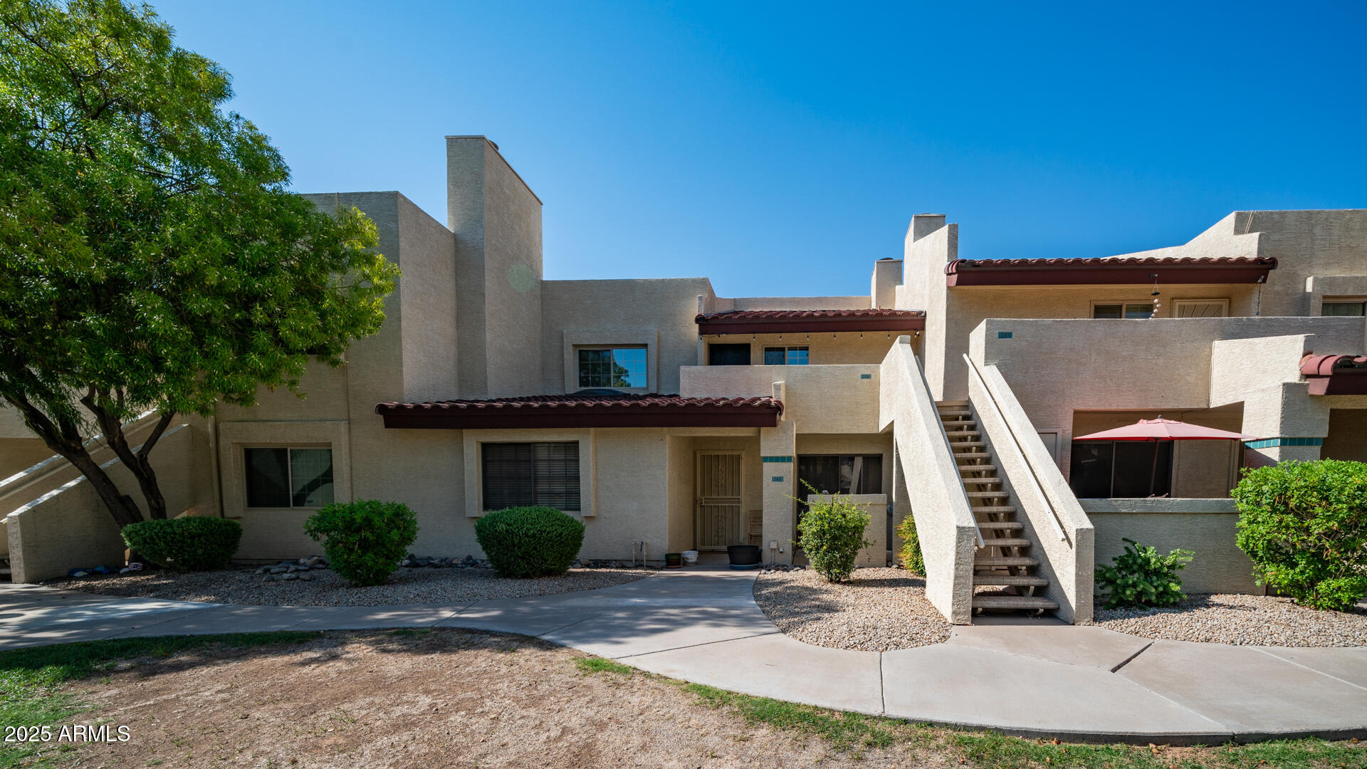 2020 West Union Hills Drive, Unit 246 Phoenix, AZ 85027 - Photo 6 of 23 a front view of a house with a yard