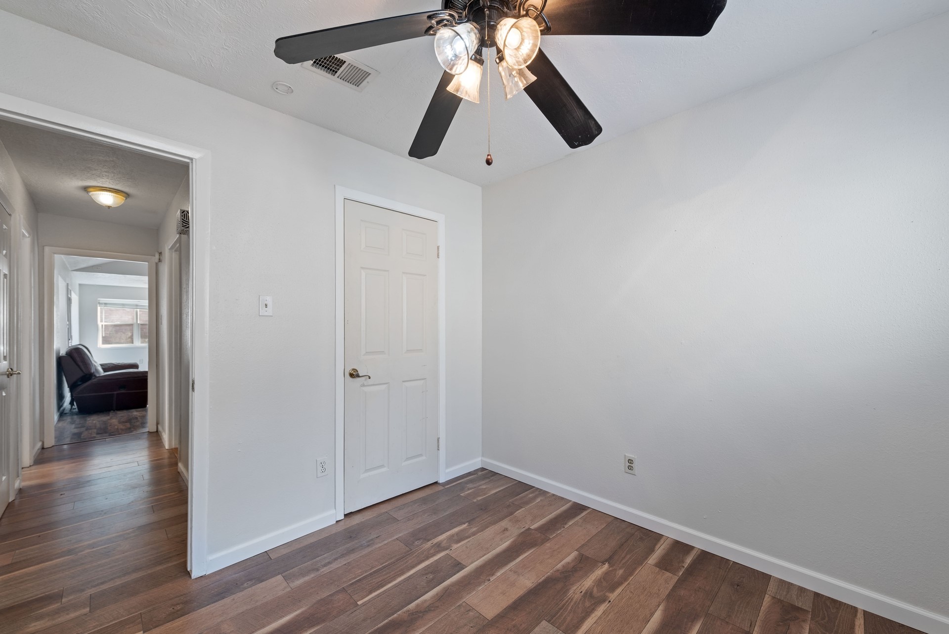 9622 Birsay Street Spring, TX 77379 - Photo 12 of 17 First of the secondary bedrooms is directly down the hall from the living areas.