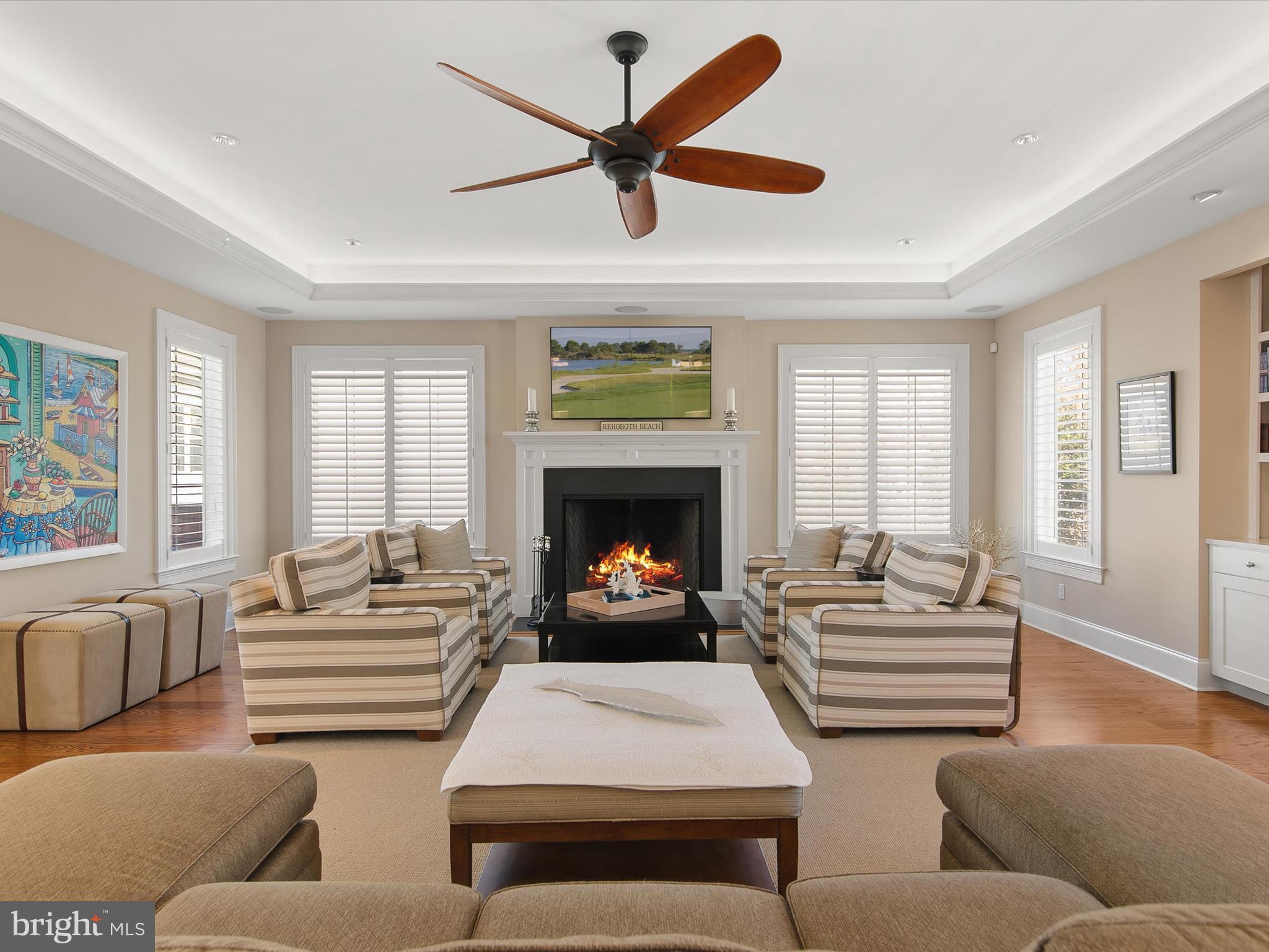 14 White Oak Road Rehoboth Beach, DE 19971 - Photo 9 of 63 The expansive living room with wood fireplace, bar