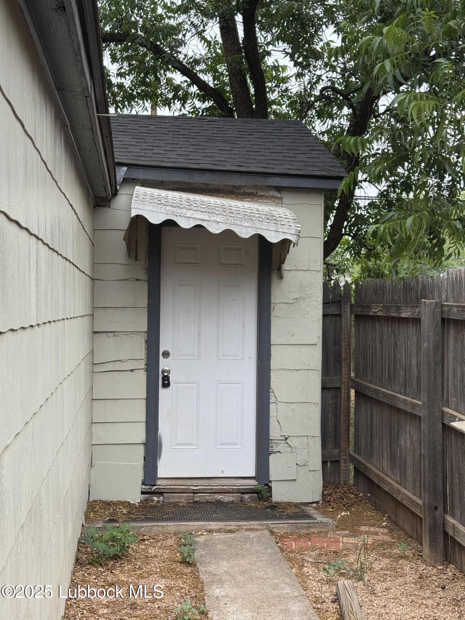 2308 33rd Street Lubbock, TX 79411 - Photo 1 of 1 a side view of a wooden door