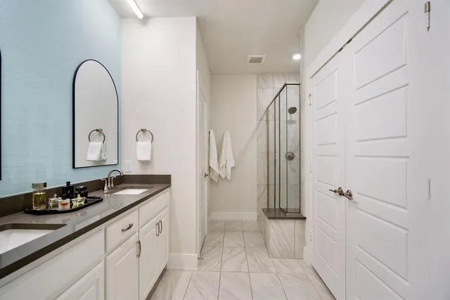 a bedroom with a bed couch and window