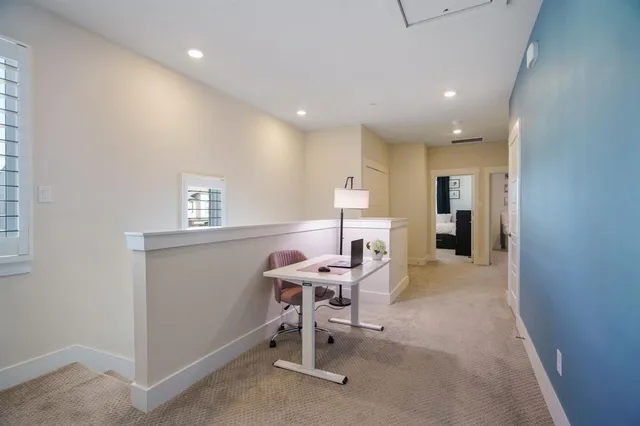 a bathroom with a granite countertop sink a toilet and a mirror