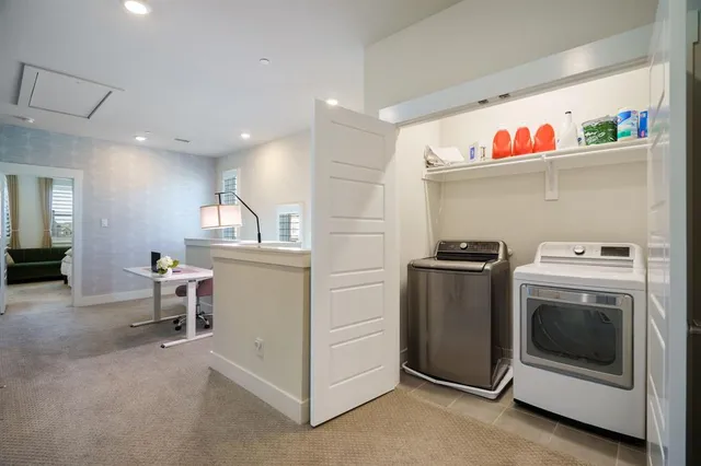 a view of a kitchen with a dining table and chairs
