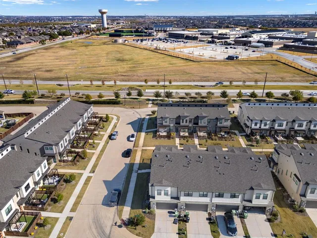 a view of a house with swimming pool and a yard