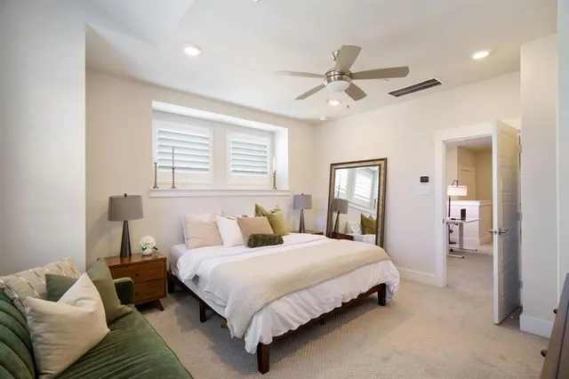 a living room with a couch and a rug
