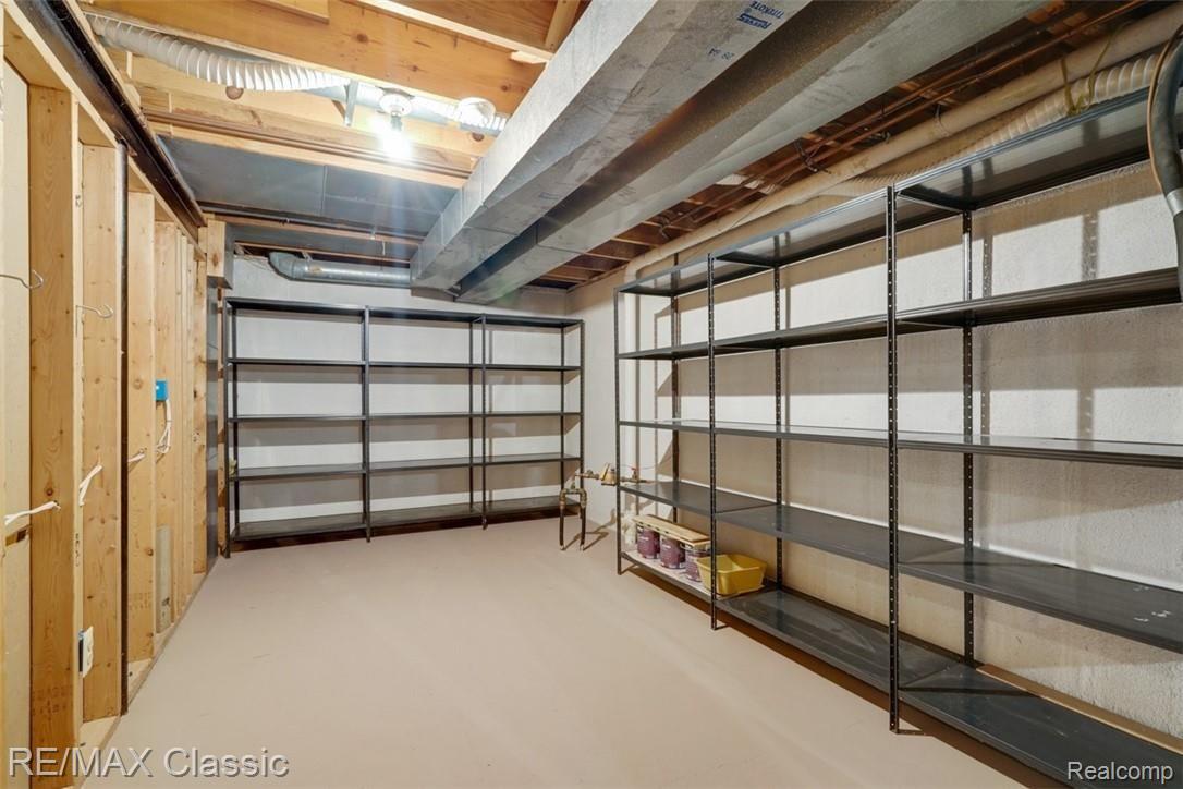 1859 Jenny Lane, Unit 252 Rochester, MI 48309 - Photo 22 of 29 Lots of Storage in Basement with Shelving Units that Stay