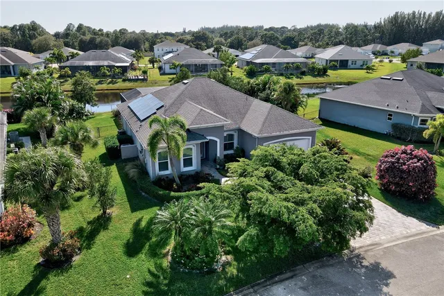 an aerial view of a house with a garden