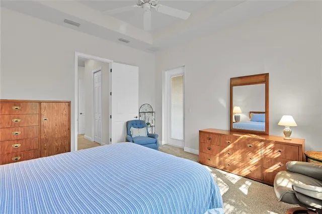 a bedroom with a bed and lamp