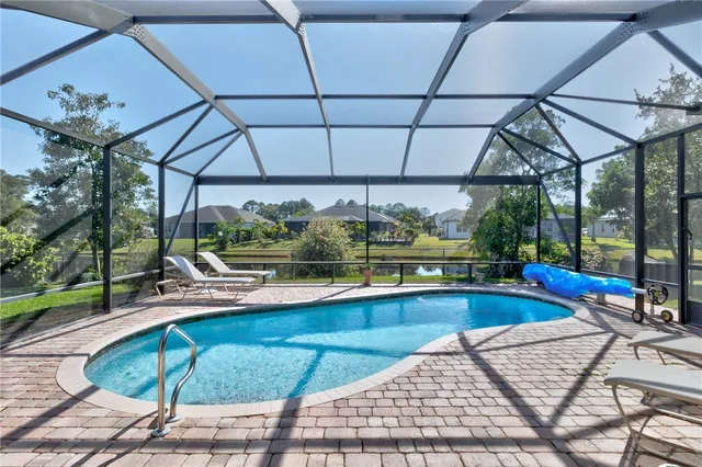 a view of a swimming pool with a patio