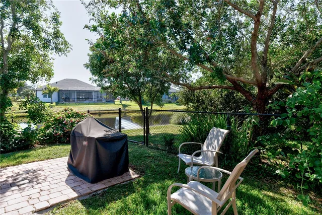 a view of a chair and fire pit in the garden