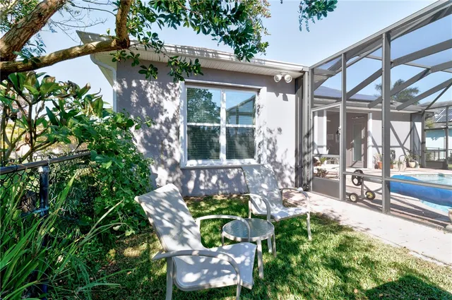 a front view of a house with outdoor seating