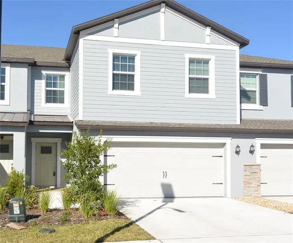 a front view of a house with a garage