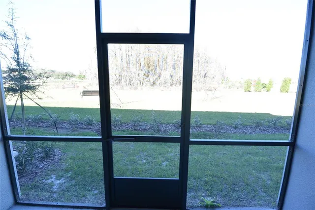 a view of a room with a large window