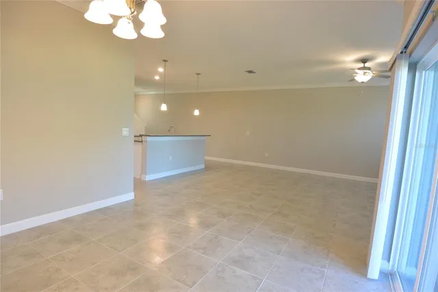 en empty room with wooden floor and window