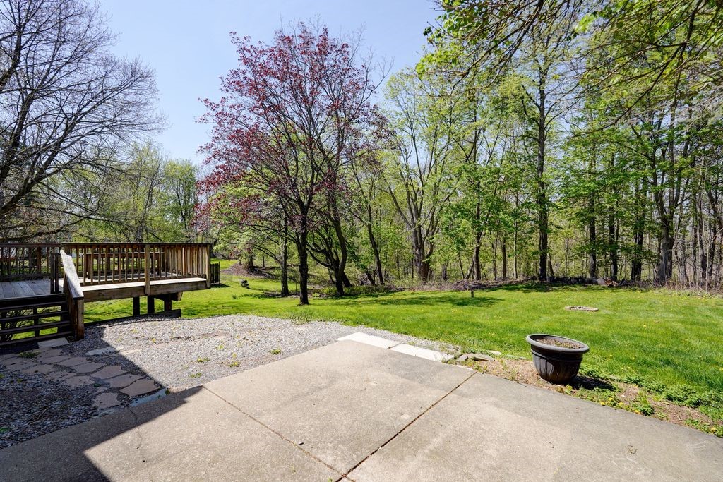 44 Latchmere Drive Victor, NY 14564 - Photo 40 of 50 PATIO VIEW TOWARDS THE DECK AND REAR YARD JUST OUT