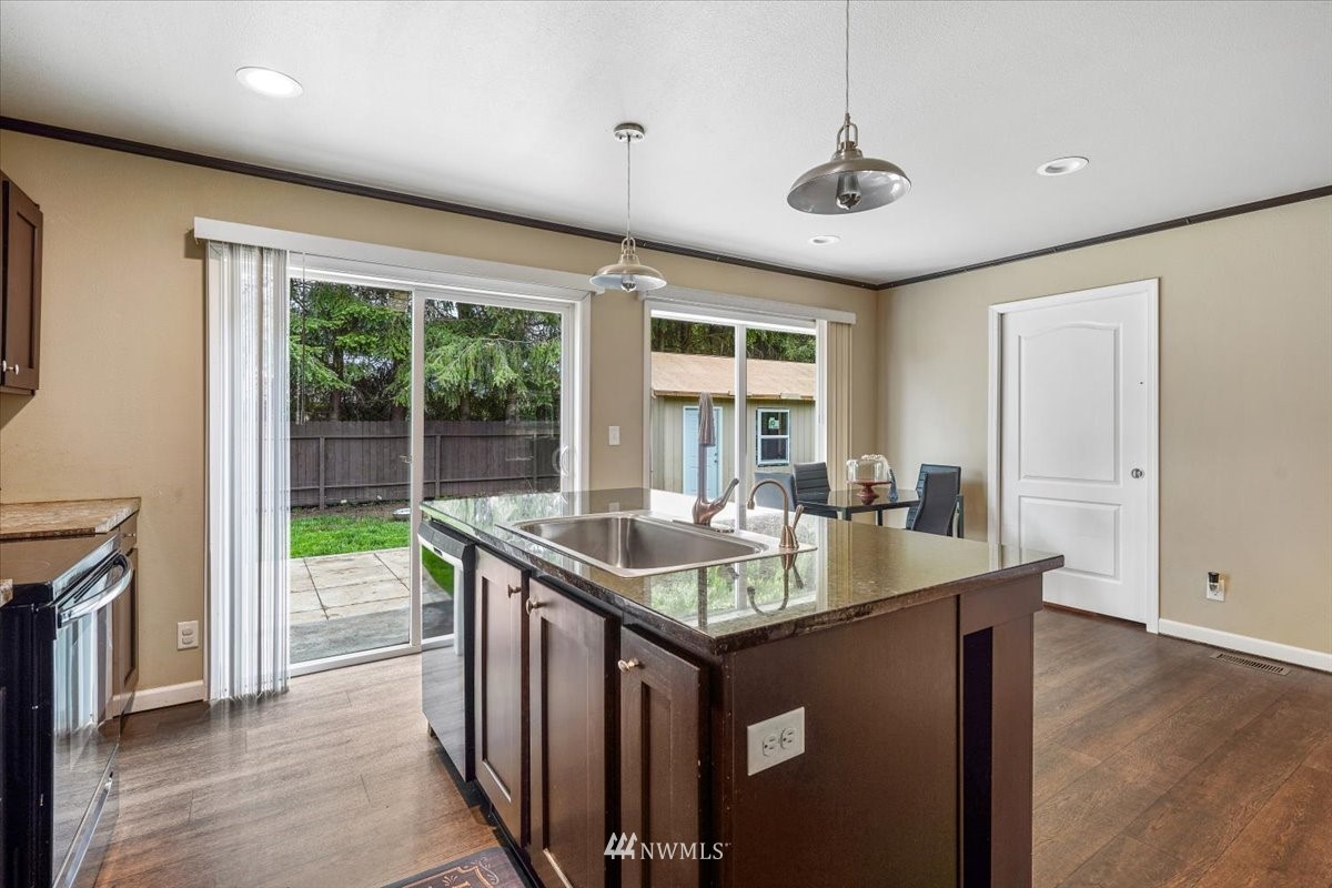 503 Maple Street Pe Ell, WA 98572 - Photo 16 of 27 a view of a kitchen counter top space and wooden floor
