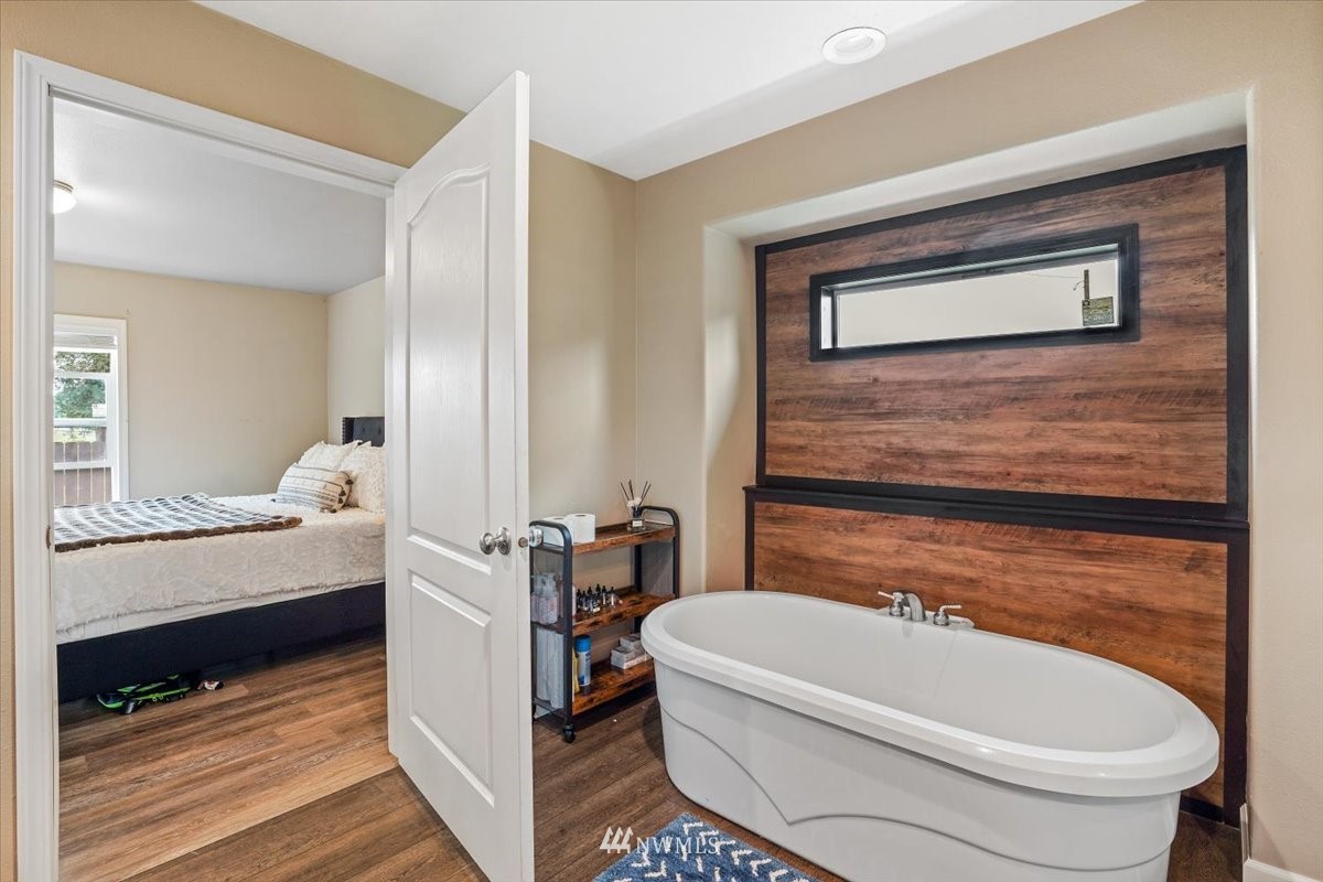 503 Maple Street Pe Ell, WA 98572 - Photo 19 of 27 a bathroom with a white tub shower and toilet