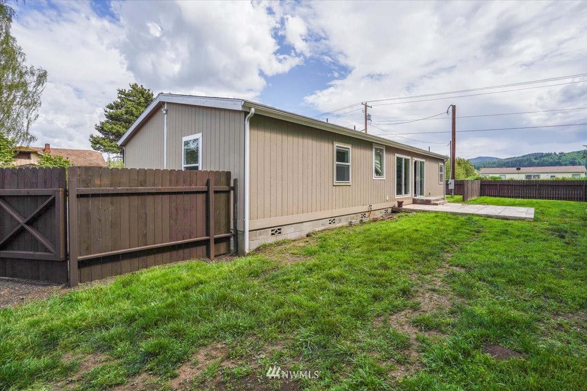 503 Maple Street Pe Ell, WA 98572 - Photo 24 of 27 a front view of a house with garden