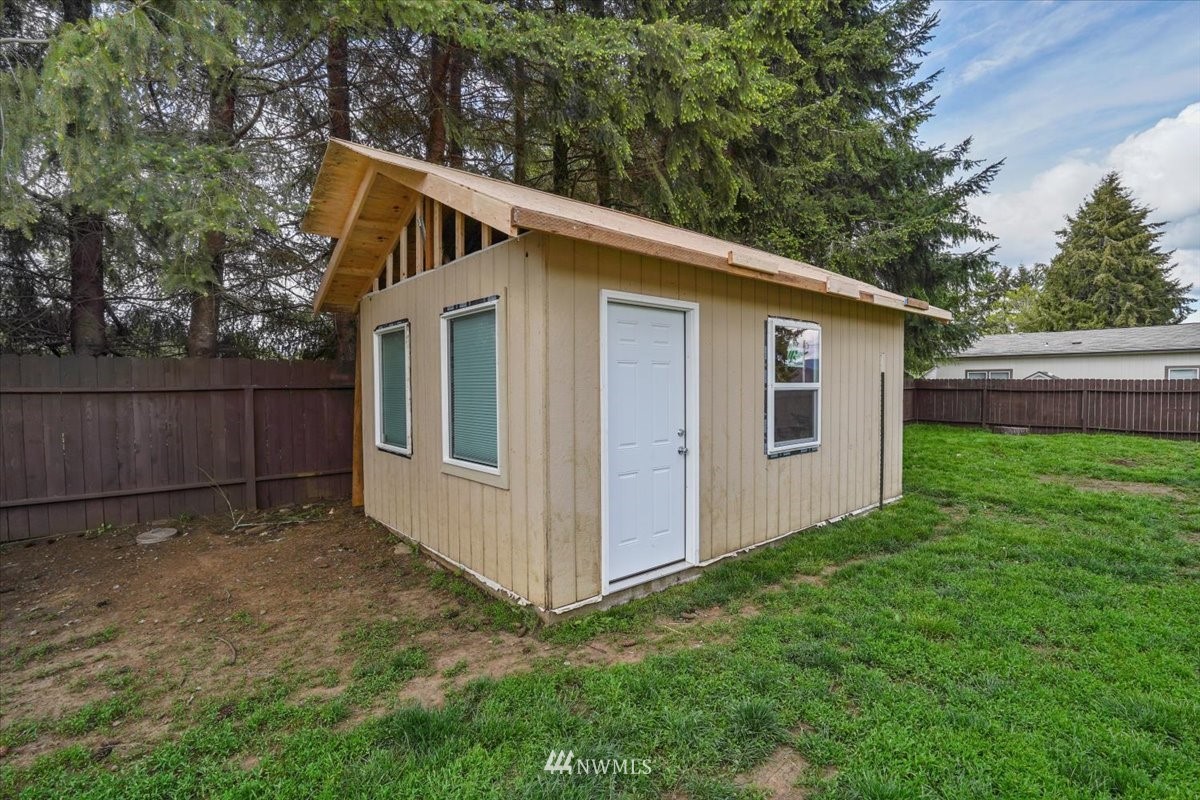 503 Maple Street Pe Ell, WA 98572 - Photo 26 of 27 a view of backyard of house with wooden fence