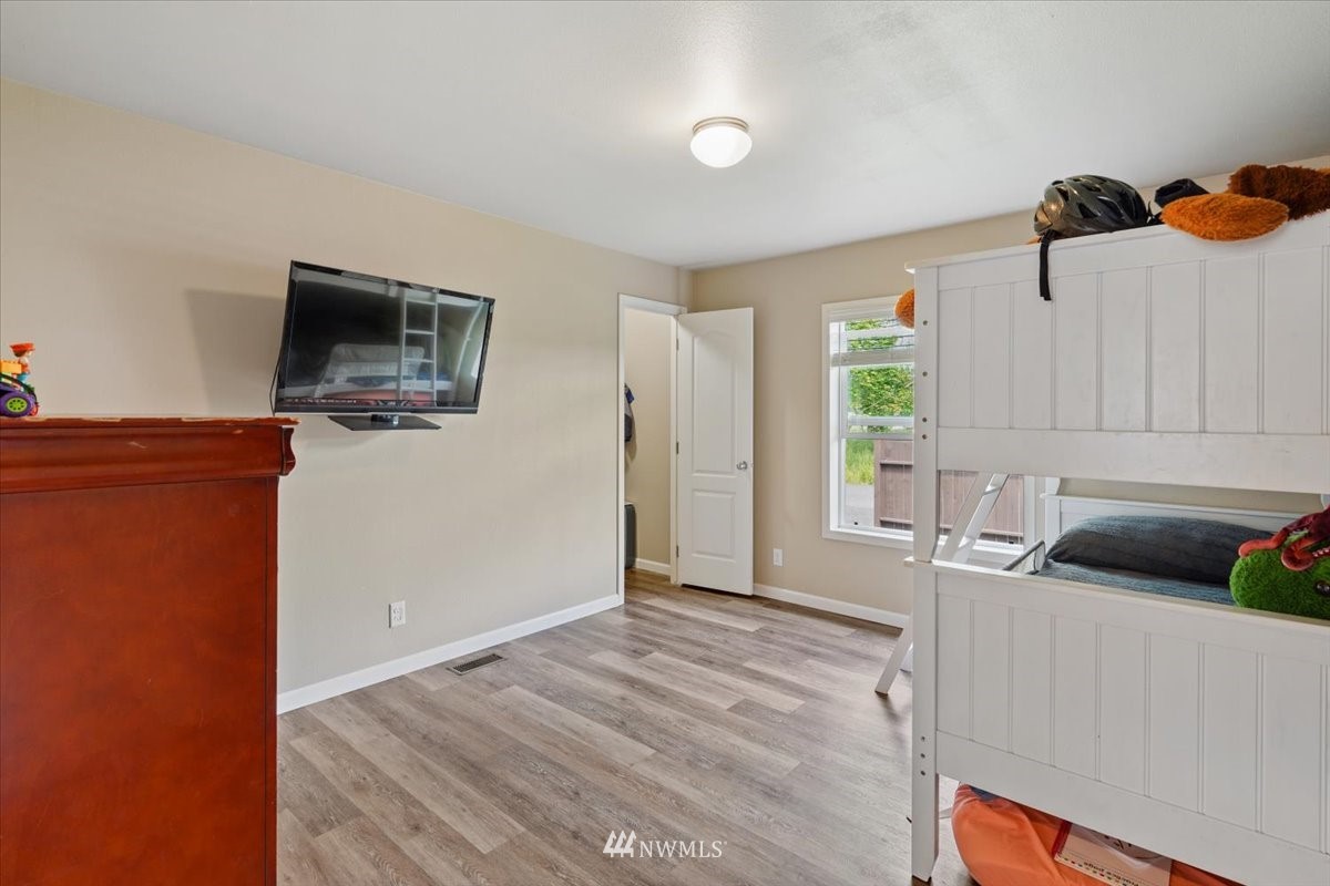 503 Maple Street Pe Ell, WA 98572 - Photo 4 of 27 a bedroom with furniture and a flat screen tv