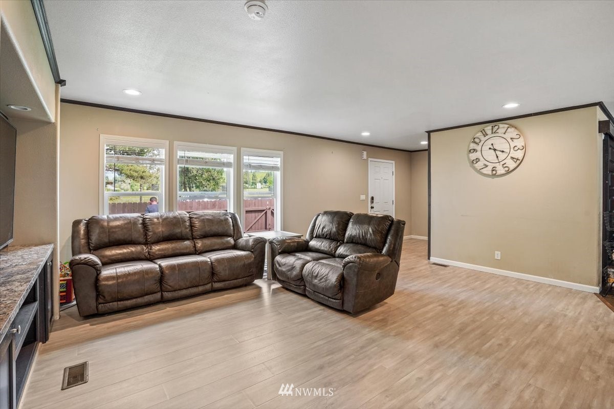 503 Maple Street Pe Ell, WA 98572 - Photo 7 of 27 a living room with furniture window and a wooden floor