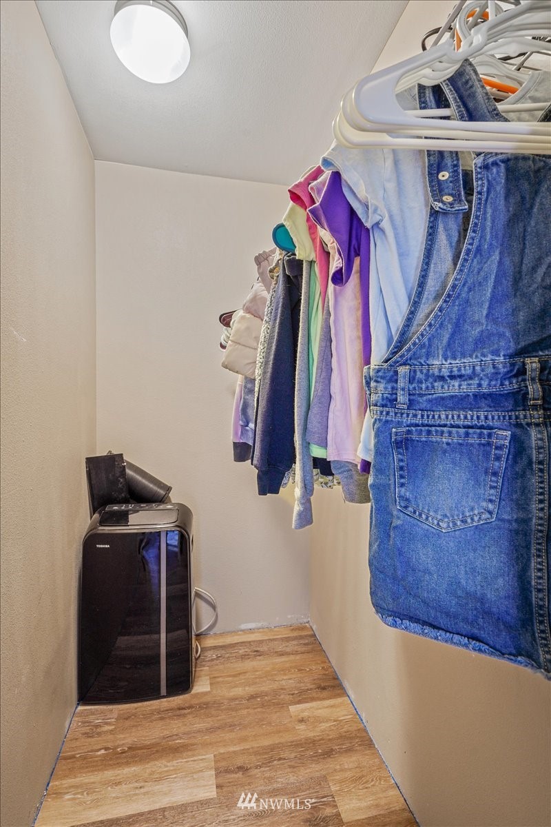 503 Maple Street Pe Ell, WA 98572 - Photo 9 of 27 a view of walk in closet with clothes and shoes