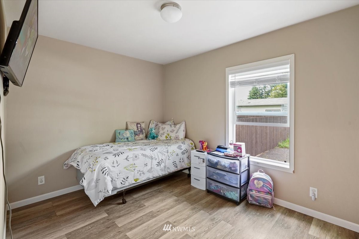 503 Maple Street Pe Ell, WA 98572 - Photo 10 of 27 a bedroom with a bed and a window