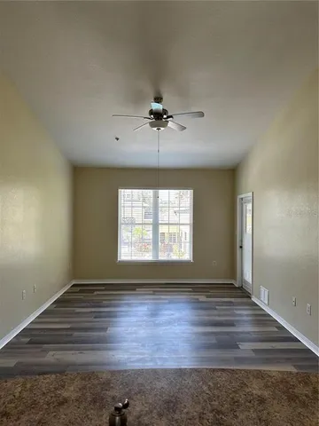 a view of an empty room with a window