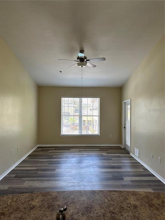 10112 Courtney Palms Boulevard, Unit 201 Tampa, FL 33619 - Photo 8 of 15 a view of an empty room with a window