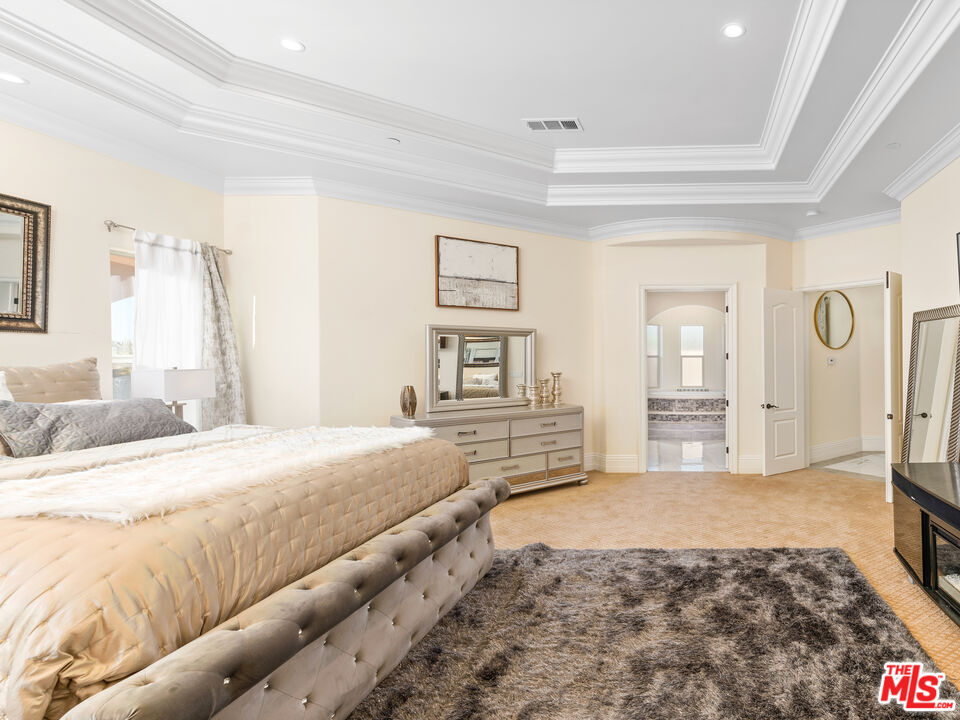 14420 Merlot Court Riverside, CA 92508 - Photo 15 of 57 a bedroom with a large bed and a dresser