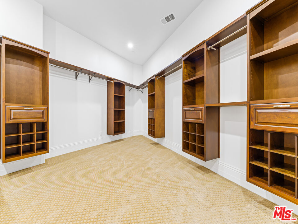 14420 Merlot Court Riverside, CA 92508 - Photo 19 of 57 a view of an empty room with a window and cabinet