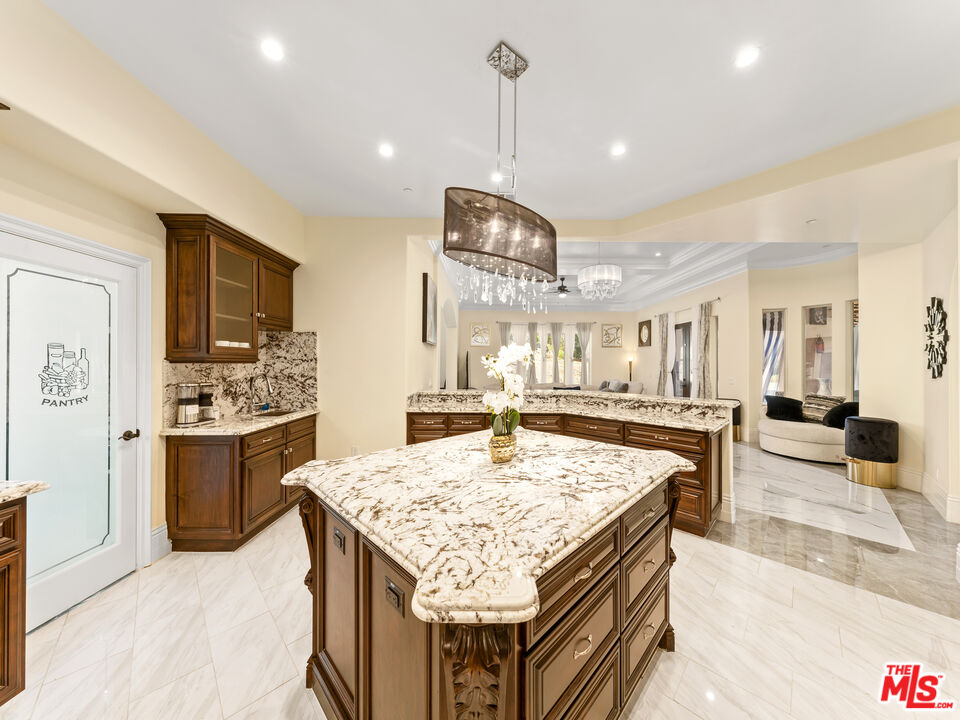 14420 Merlot Court Riverside, CA 92508 - Photo 20 of 57 a kitchen with stainless steel appliances granite countertop counter space and wooden floor