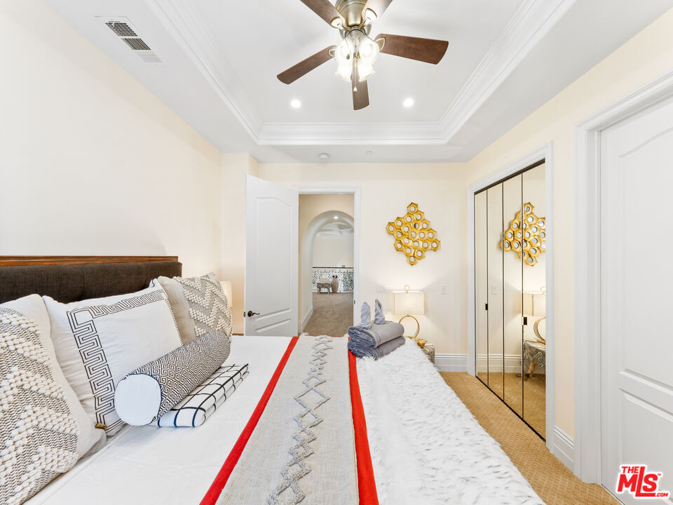 14420 Merlot Court Riverside, CA 92508 - Photo 45 of 57 a bedroom with a bed and a chandelier