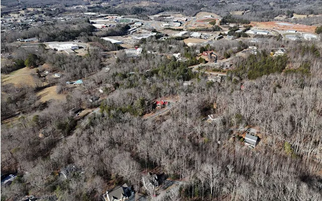 an aerial view of residential house and sandy dunes