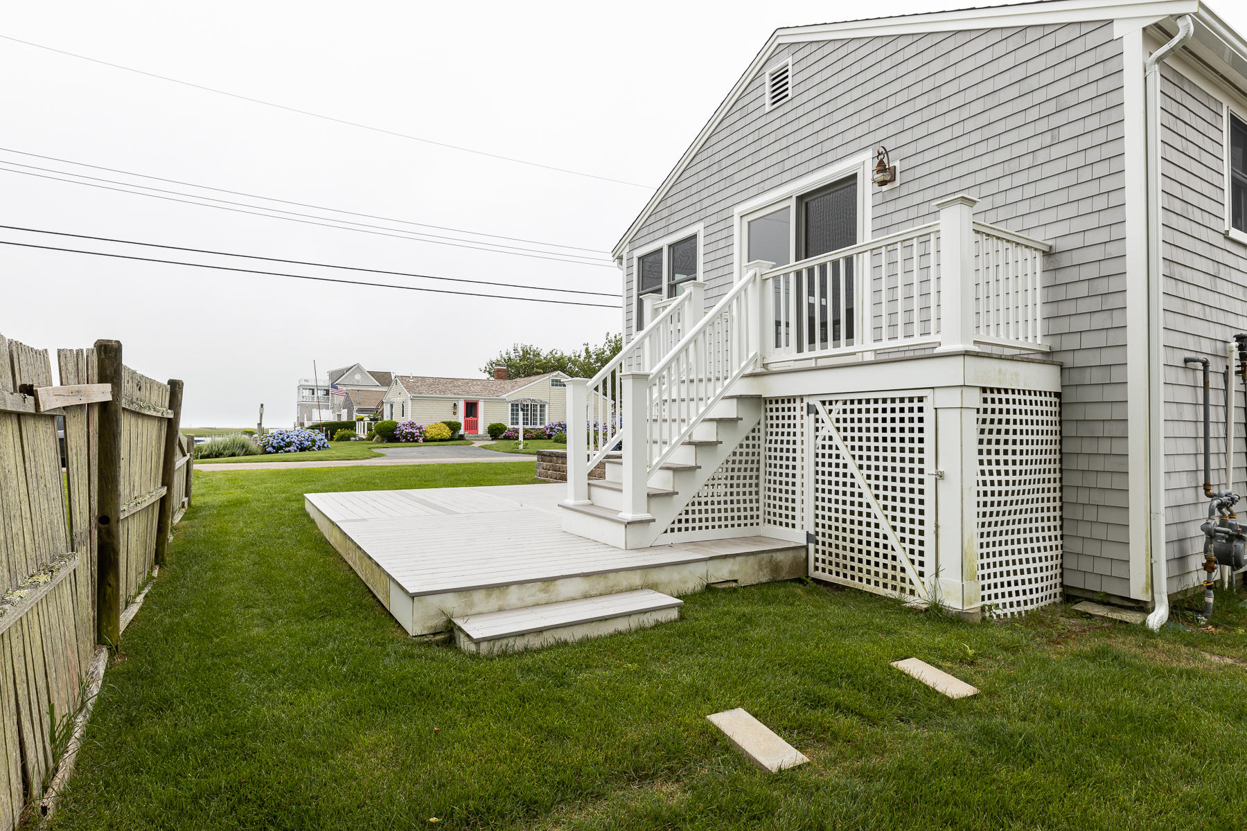 46 Surfside Road West Dennis, MA 02670 - Photo 27 of 32 a front view of a house with a yard
