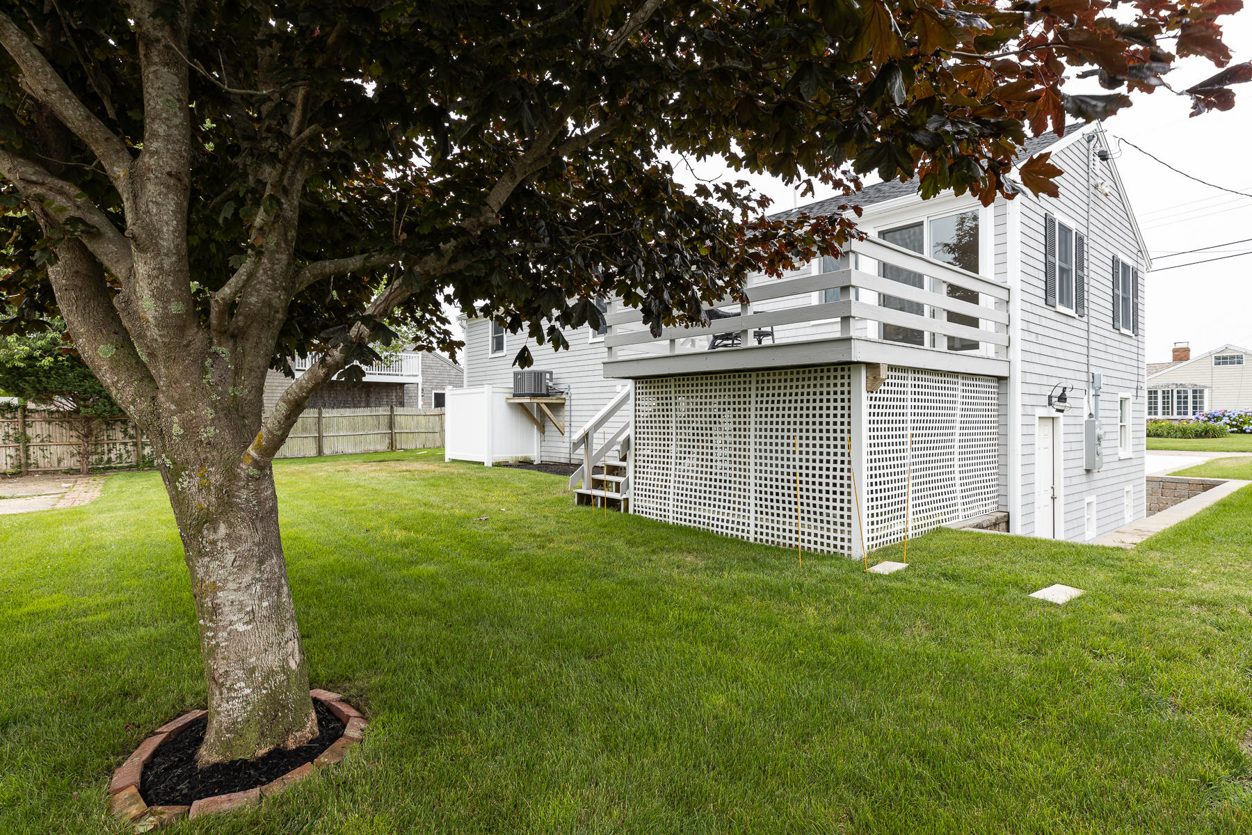 46 Surfside Road West Dennis, MA 02670 - Photo 29 of 32 a view of a house with a yard