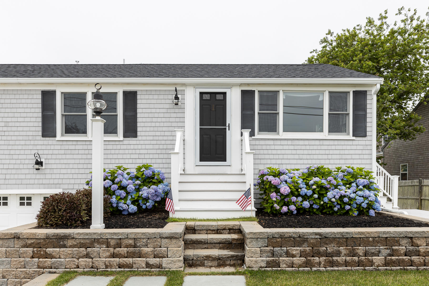 46 Surfside Road West Dennis, MA 02670 - Photo 3 of 32 a front view of a house with a yard