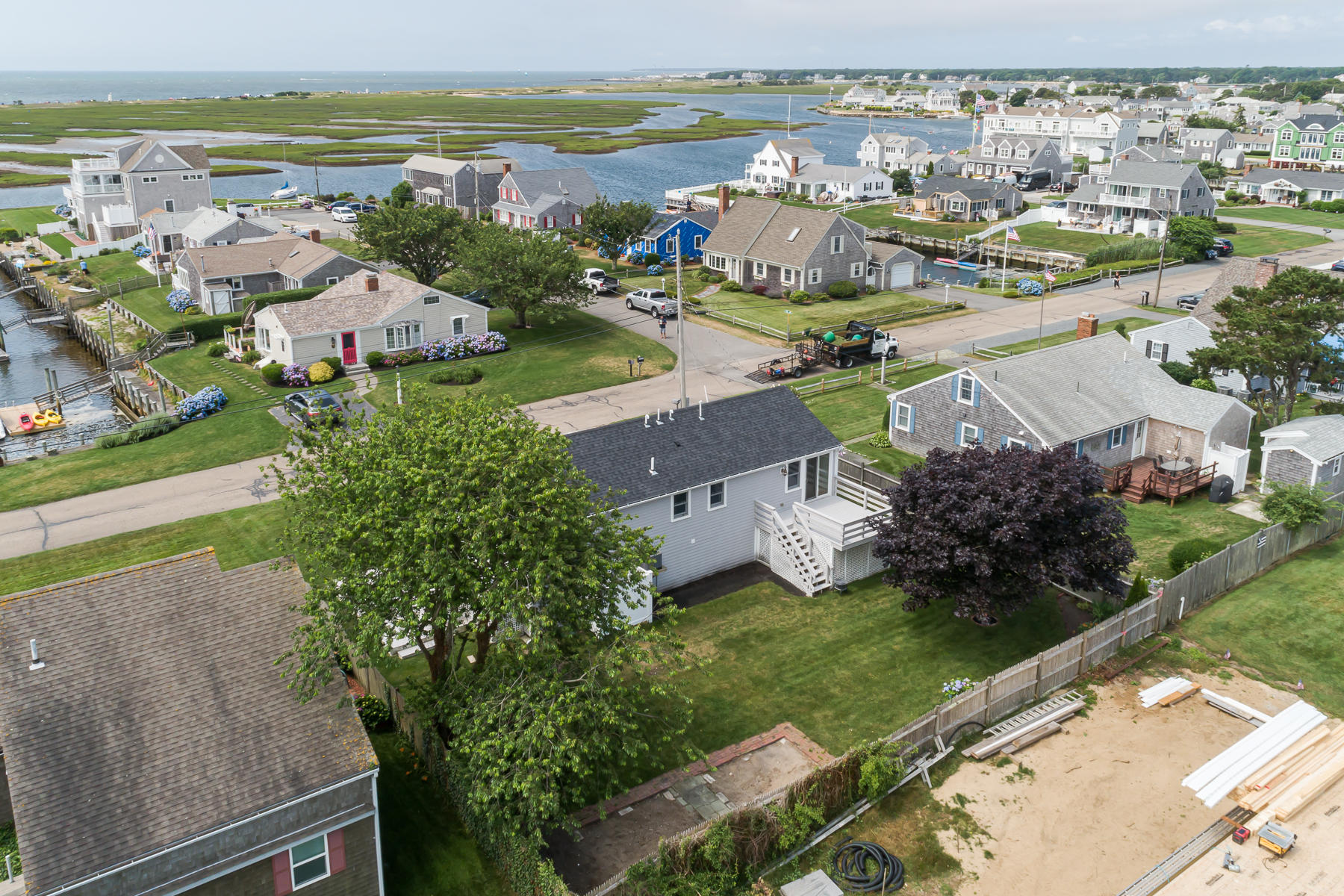 46 Surfside Road West Dennis, MA 02670 - Photo 6 of 32 a view of a city with an ocean view