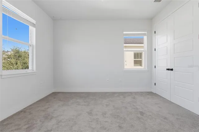 an empty room with windows