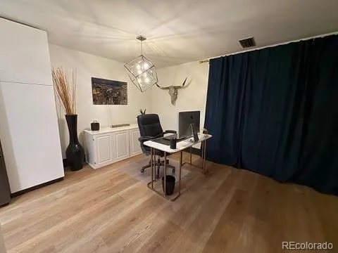 a living room with furniture a table and chairs