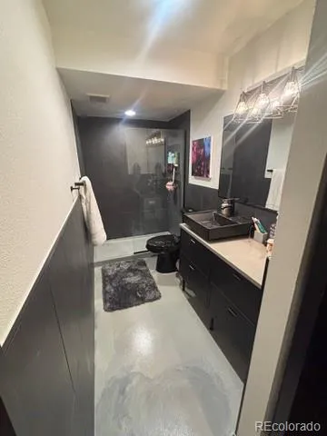 a kitchen with sink refrigerator and window