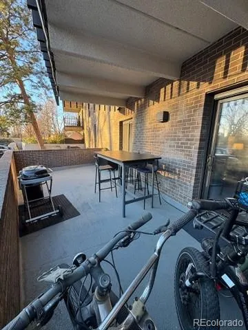a room with gym equipment and a flat screen tv