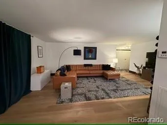 a living room with furniture and a rug