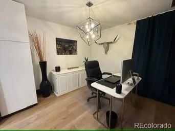 a workspace with furniture and a window