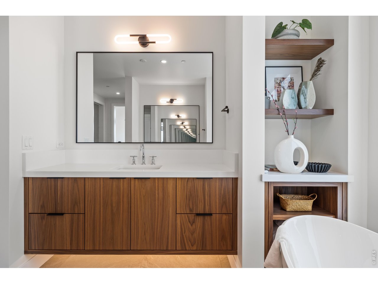 9578 Mountain Ridge Drive Boulder, CO 80302 - Photo 25 of 47 a bathroom with a sink a mirror and vanity