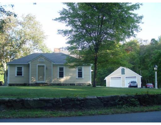 37 Robinson Road Rochester, MA 02770 - Photo 2 of 11 a front view of a house with garden