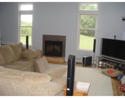 37 Robinson Road Rochester, MA 02770 - Photo 4 of 11 a living room with furniture a flat screen tv and a window