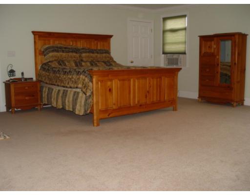 37 Robinson Road Rochester, MA 02770 - Photo 7 of 11 a bedroom with a bed and window