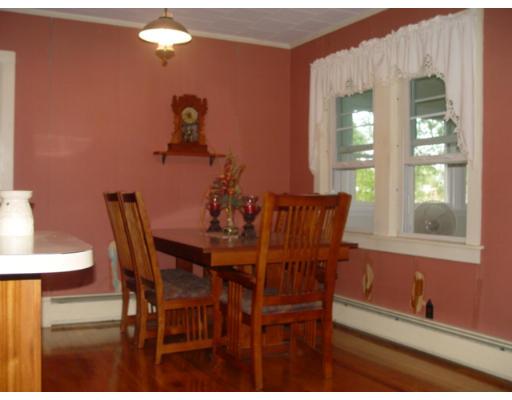 37 Robinson Road Rochester, MA 02770 - Photo 10 of 11 a view of a dining room with furniture and chandelier