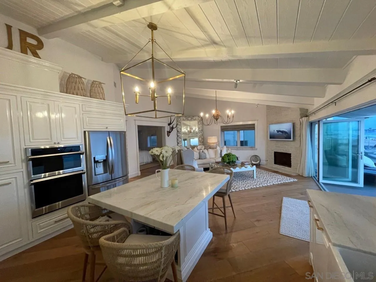 666 Ocean Lane Imperial Beach, CA 91932 - Photo 6 of 15 a view of a dining room with furniture and a kitchen view